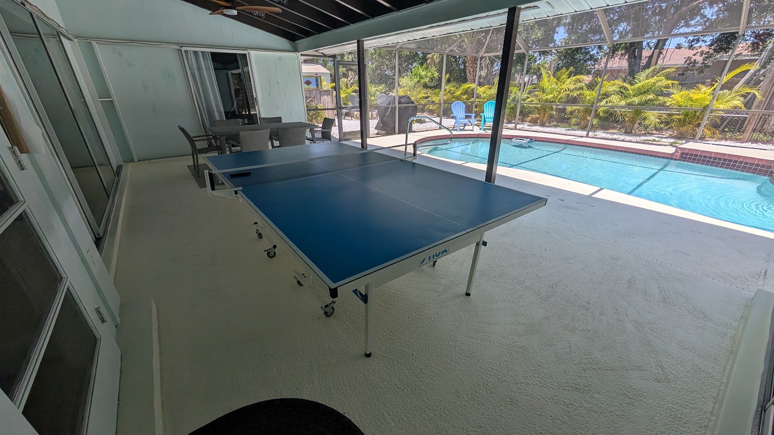Game room with pool view