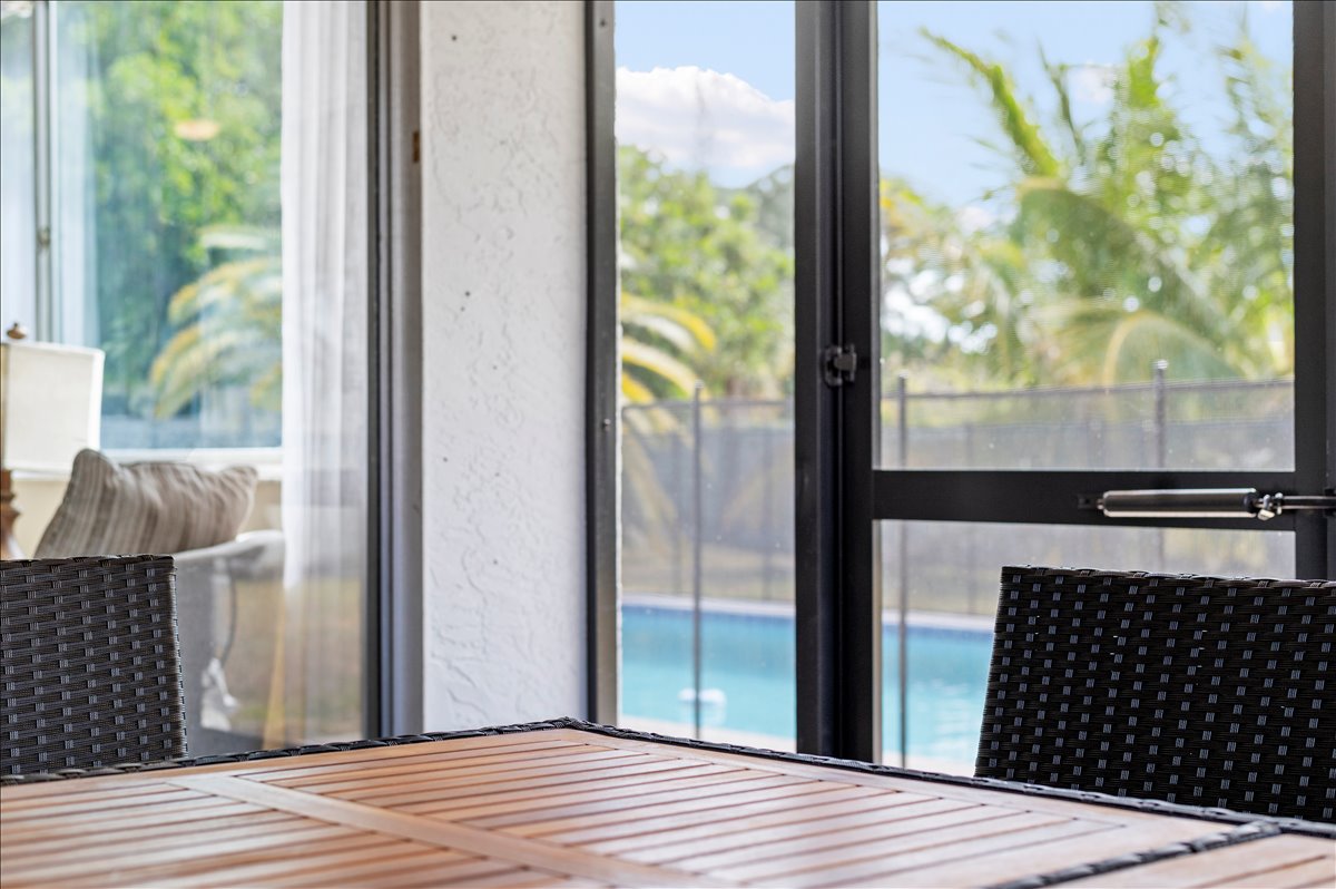 Screened lanai with pool view